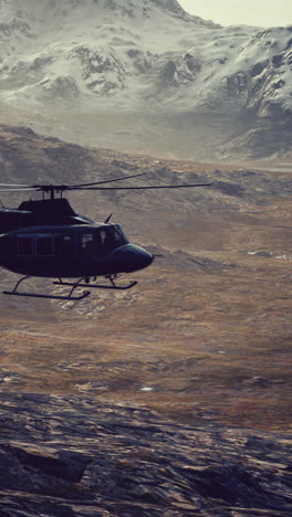 slow motion vietnam war era helicopter in mountains