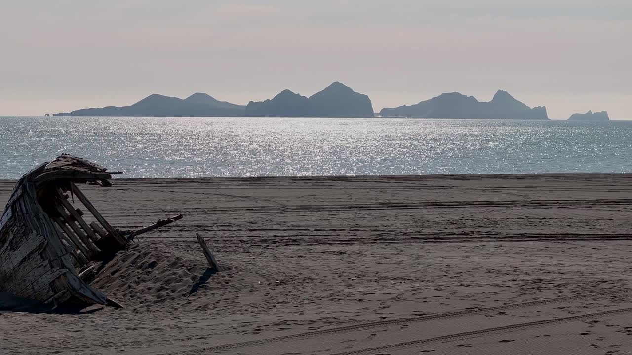 Serene View Of An Abandoned Wreck Wooden Boat At The Shores Of Vestmannaeyjar Archipelago In Iceland. Aerial Shot