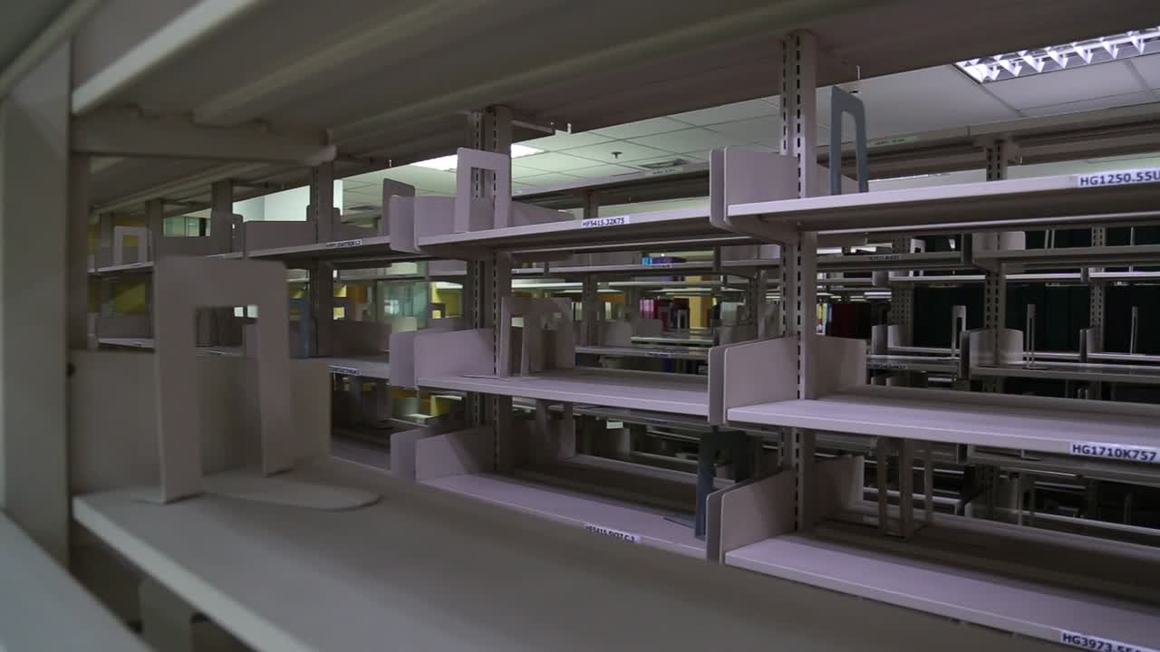 Static shot of empty bookshelves in a library