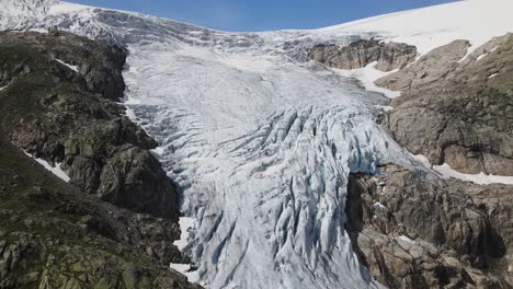 zooming out drone footage of glacier in folgefonna national park in norway