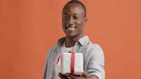 happy man giving a gift