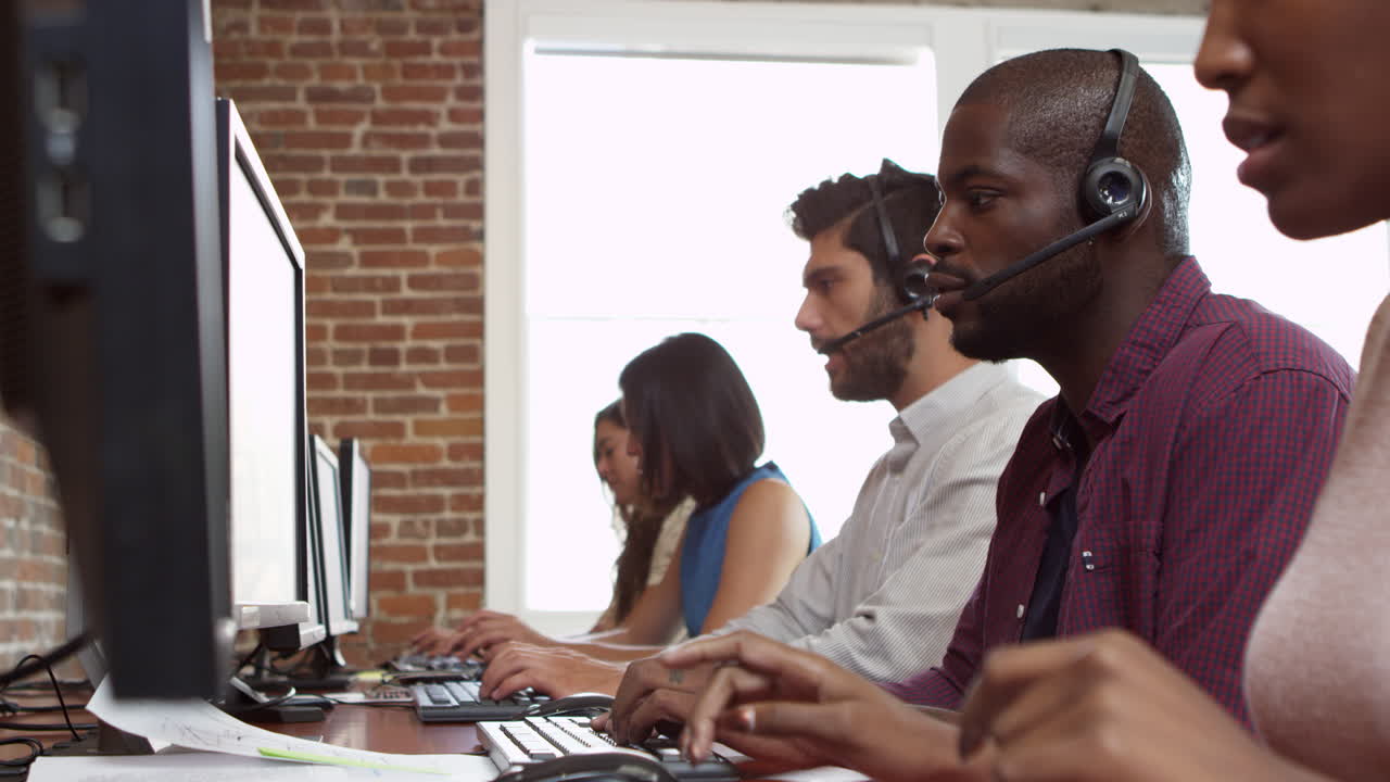 Staff At Desks In Customer Service Department Shot On R3D