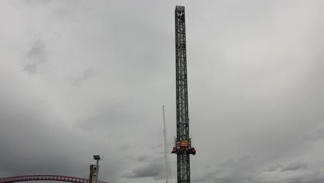 a wide shot of a family amusement theme park volcano ride