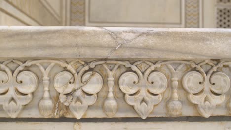 panning shot of decorative detail on the taj mahal