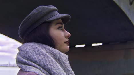 woman in a grey hat and scarf