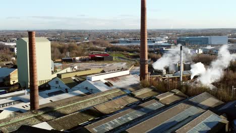 pilkington glass factory warehouse buildings aerial descending view industrial facility rooftop