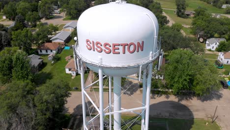 drone boom pull-out shot of sisseton water tower.