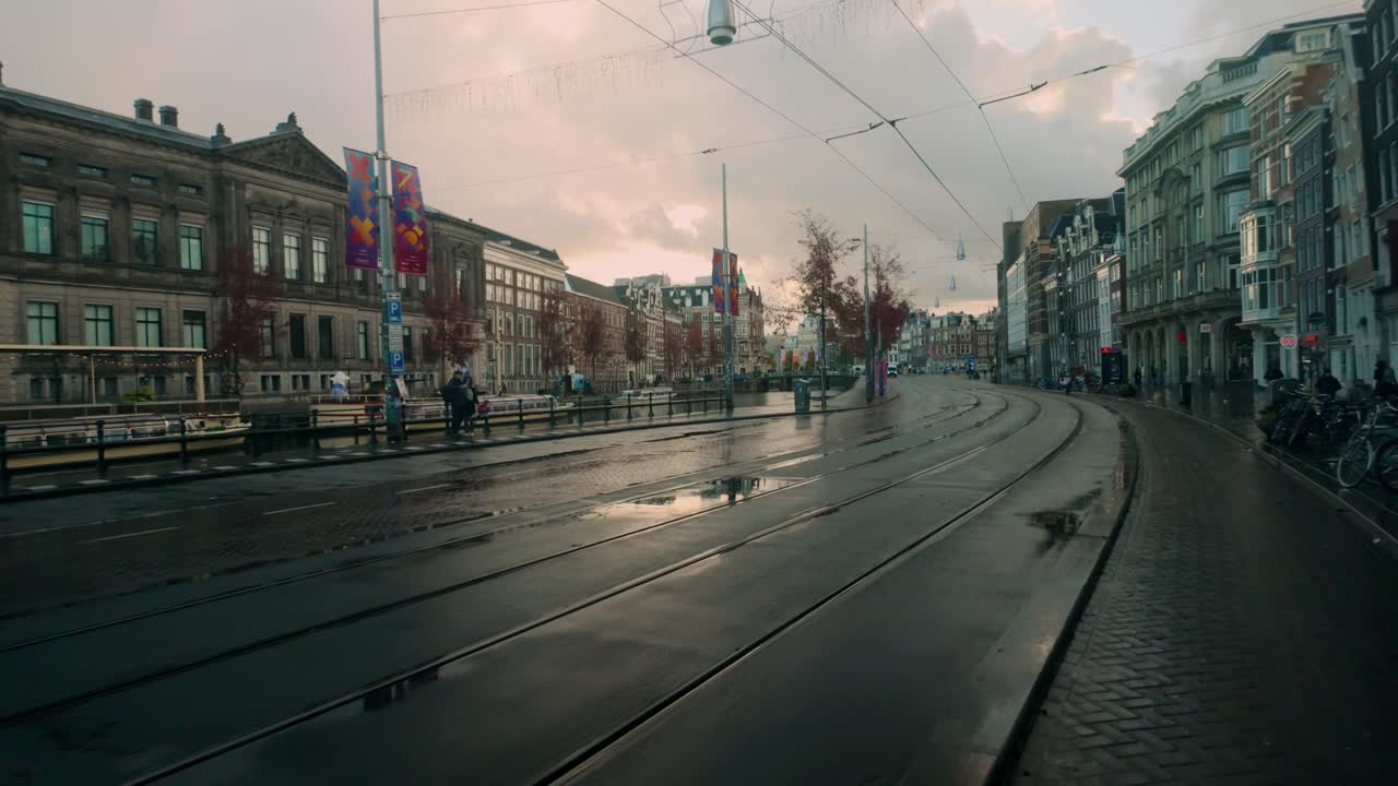 Rainy Day in Amsterdam: Canal-Side Tram Tracks