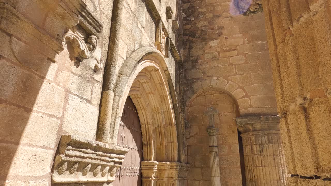 Tilt down shot of Santiago El Mayor Church doorway, Historical church in Caceres