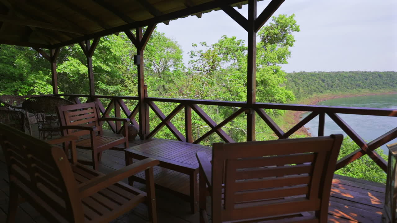 Luxury rainforest lodge terrace made of wood and wicker furniture, Misiones, Argentina, wellness travel