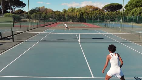 video of top view of diverse female tennis players on court during match