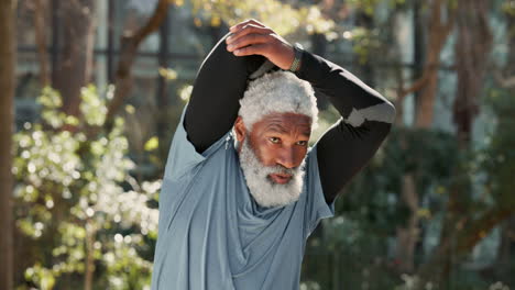 a senior man stretching and running in a park