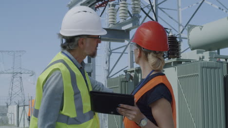 power station engineers inspecting a transformer