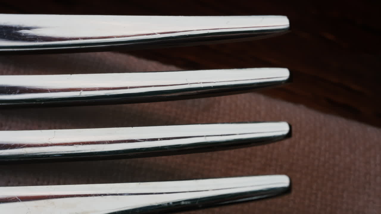 Close up of fork tines with soft reflections