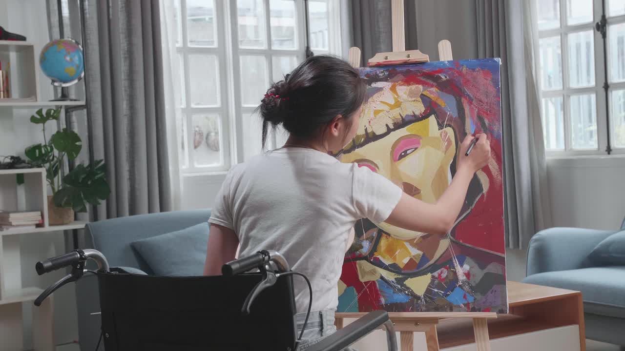 Woman Painting a Portrait in a Wheelchair