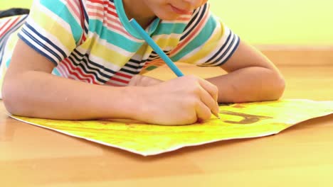 Small-boy-drawing-on-some-paper