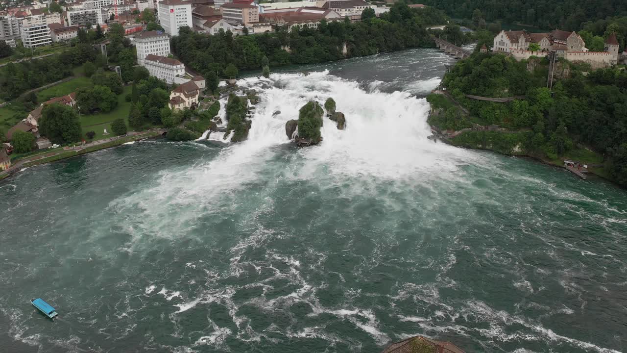 Waterfalls of Rhine, aerial view showing powerful water flow and surrounding nature
