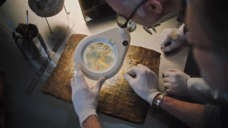 archaeologists examining an ancient egyptian papyrus