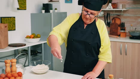 Taking-flour-from-glass-bowl