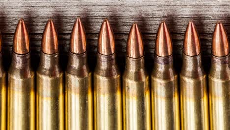 close up rifle bullets, top view, panning shot, war and armed crime concept