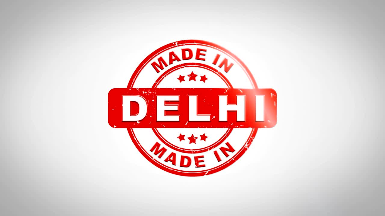 hecho en delhi firmado estampado texto animación de sello de madera. tinta roja en papel blanco limpio fondo de superficie con fondo matte verde incluido.