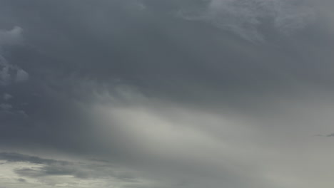 slow moving time lapse of beautiful evening clouds with muted warm tones