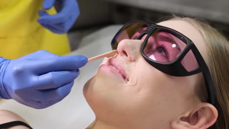 woman undergoing hair removal procedure