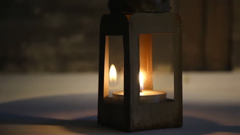 warm glow of a candle in a lantern