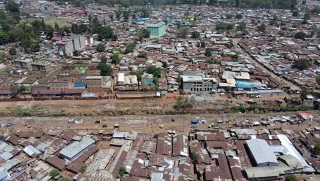 panoramic view of the drone flying over the concentrated slum houses of kibera kenya