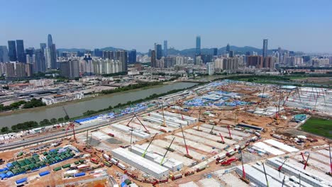 massive construction site with cranes and development in hong kong