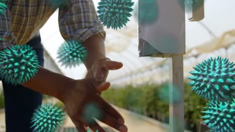 animation of macro coronavirus covid-19 cells spreading over man washing his hands