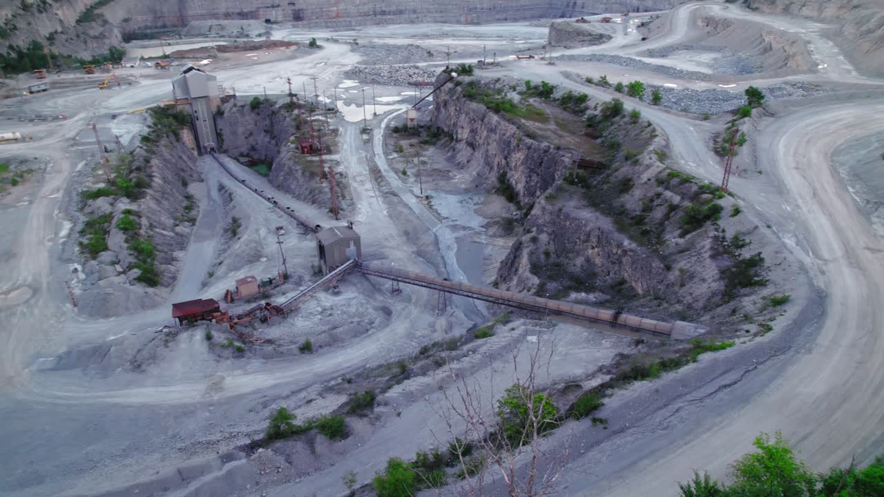 Panormaic aerial of Thornton Quarry and road with cars driving