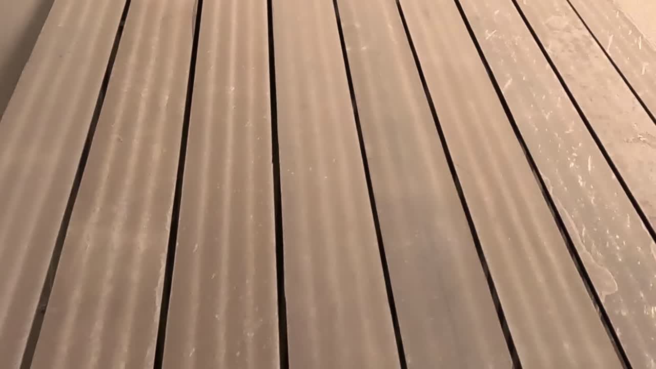 Close-up view of stacked corrugated metal sheets