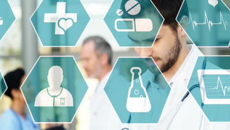 animación de iconos médicos sobre un grupo diverso de doctros que trabajan