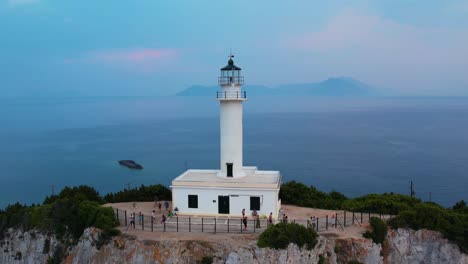 aerial view of doukáto lighthouse on lefkada island with misty landscape sea in background