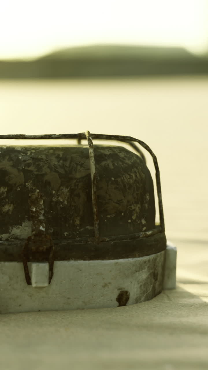 Mysterious object resting on sandy beach at sunset creates intrigue