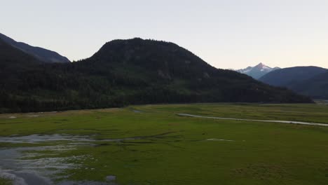 Aerial-Drone-Fast-Panning-Shot-of-Snow-Capped-Mountains-and-Soo-River-British-Columbia-Canada-4K