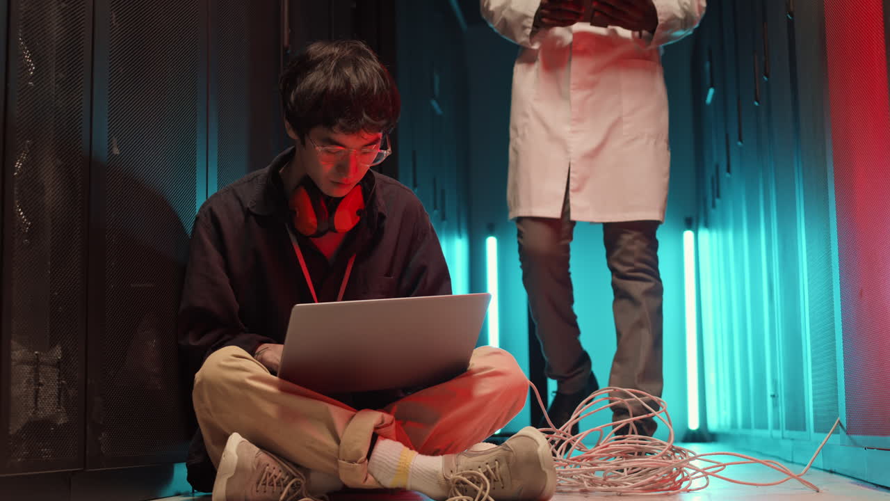 Manager Asking IT Engineer Taking Away a Wire