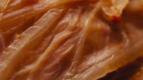 close-up of texture fermented spicy cabbage kimchi with in can. preservation of vegetables in glass jars. fermentation preserved kimchi cabbage with spices macro. asian cuisine.