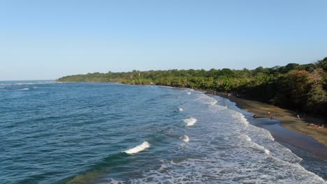 Costa-Rica-beach-drone-view-showing-sea,-shore-and-forest