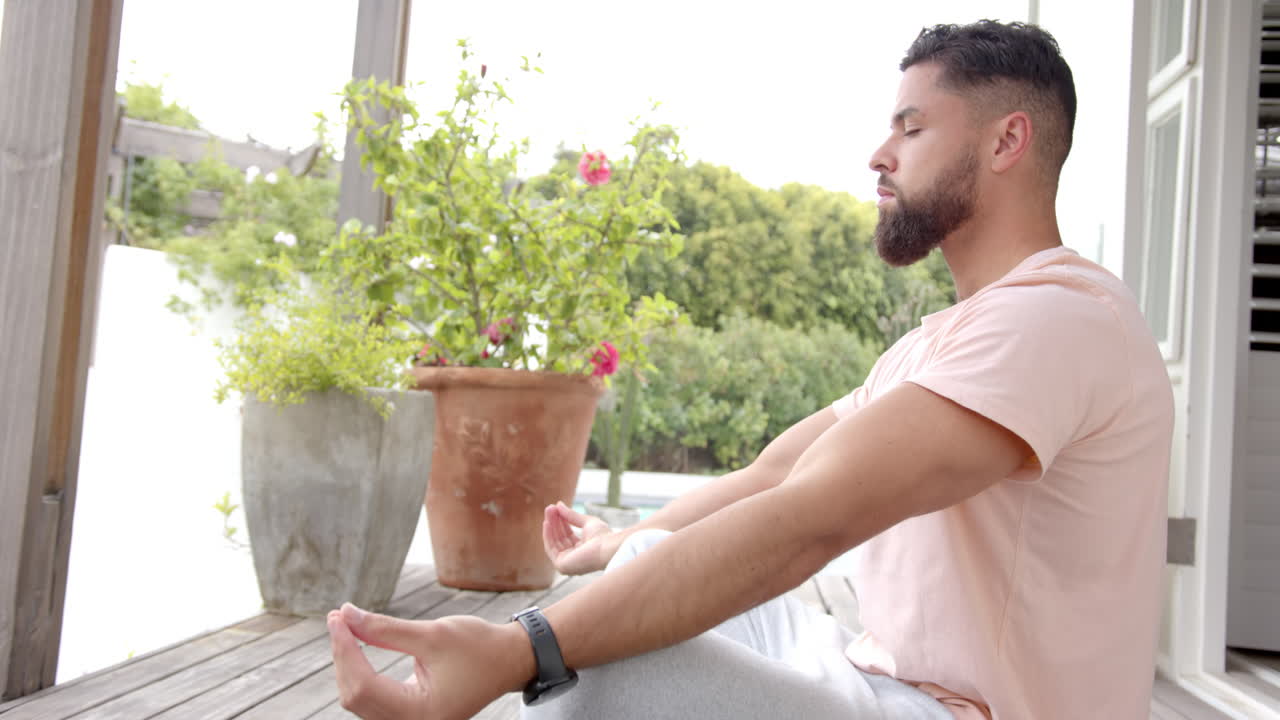Practicing mindfulness and relaxation, man meditating on porch outdoors, copy space
