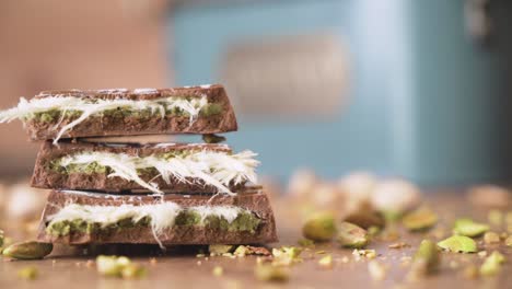 Rich Dubai chocolate captured in macro detail with pistachio pieces sprinkled on top