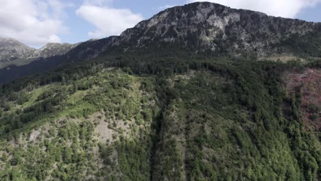 video with drone of front plane crane descending to a mountain of the vermosh valley, the sh20, albania