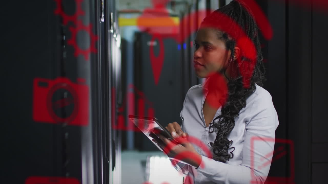 Animation of media icons over african american businesswoman using tablet