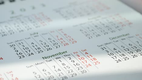 Detail-shot-of-a-calendar-on-table,