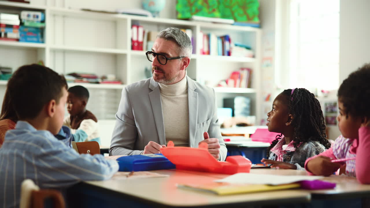 Teacher Giving High Five to Students in Elementary School Classroom