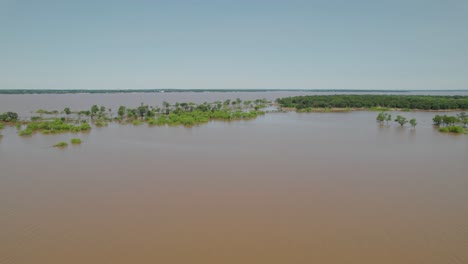 aerial footage of lake texoma flooding. trees can be seen submerged below the water