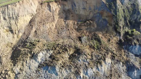 aerial backward shot showing the huge cliff fall at seatown in dorset england
