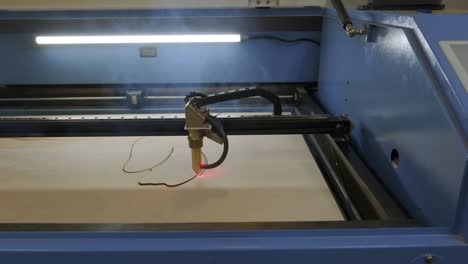 cnc laser cutting machine cuts wooden plank and plywood