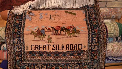 a carpet made in bukhara, uzbekistan with word of great silk road